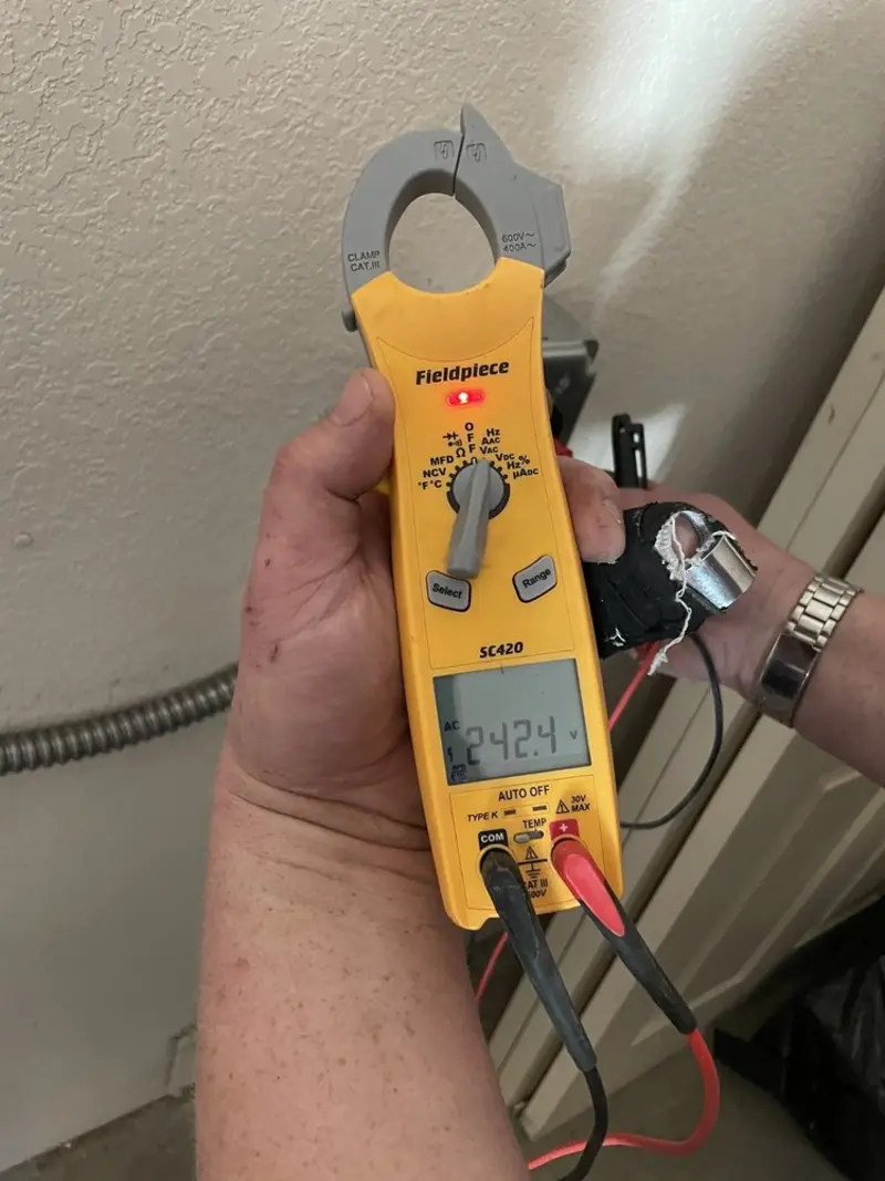 Voltage testing with clamp meter during Generator Installation in Westwood Lakes